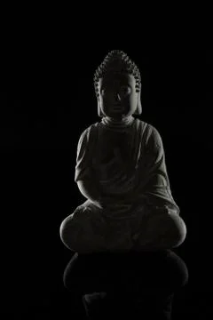Buddha on a reflective surface Stock Photos