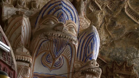 Buddha Sculpture and Wall of Artifacts | Stock Video | Pond5