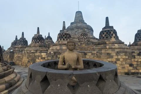 Buddha sculpture inside open stupa at Borobudur Indonesia Stock Photos