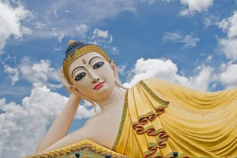 Buddha on sky background. Stock Photos