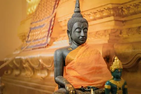 Buddha statue against golden background inside Wat Na Phramen Stock Photos