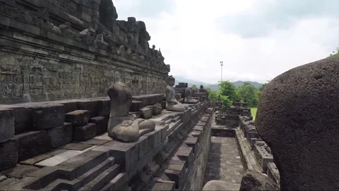 Buddha Statue, Bas Reliefs, Wall of Borobudur Temple Terrace, Java, Indonesia Stock Footage 243200240