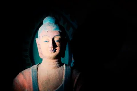 Buddha statue in a cave Stock Photos