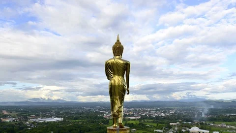 The Buddha statue with cold moving on blue sky, timelapse Stock Footage 76169950