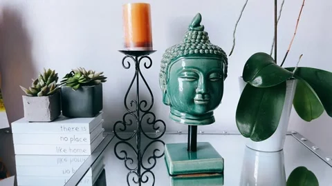 Buddha Statue on a Decorative Table for Peaceful Atmosphere Stock Footage 295663199