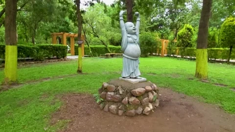 Buddha Statue in the Heart of the Park Stock Footage 313565253