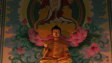 Buddha statue with his picture at the back Stock Footage 207662880