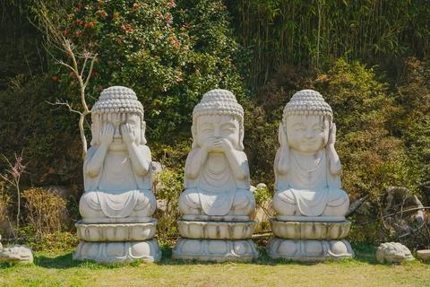 A Buddha statue with a lesson Evil Stock Photos