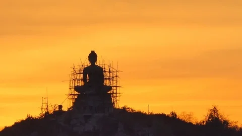 Buddha statue on mountain at sunset. Video stock 122584323