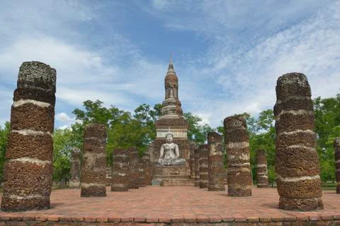 Buddha statue in old temple ruins. Sukhothai historical park Wat Mahathat. Stock Photos