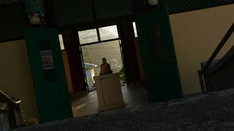 Buddha Statue on a Pedestal Stock Footage 104780200