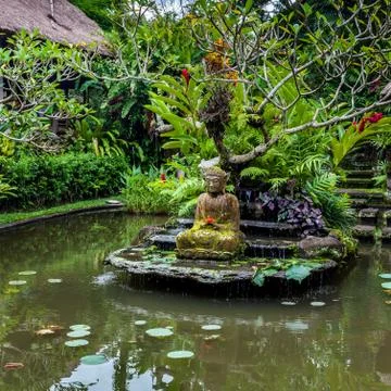 Buddha statue on a pond Stock Photos