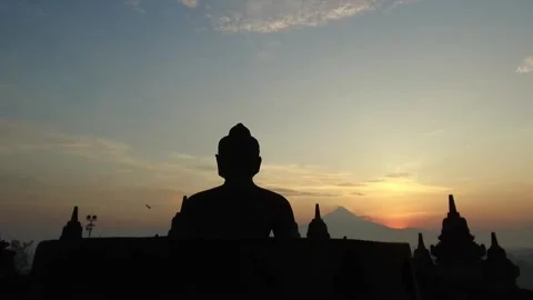 Buddha Statue at Sunset at Borobudur Temple, Java, Indonesia3 Stock Footage 131151157