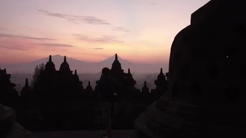 Buddha Statue at Sunset at Borobudur Temple, Java, Indonesia4 Stock Footage 131151339