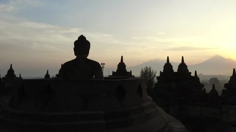 Buddha Statue at Sunset at Borobudur Temple, Java, Indonesia Stock Footage 131151349