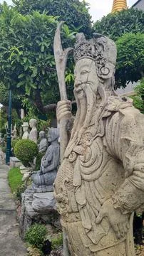 Buddha statue under authentic architecture Thailand Bangkok Stock Photos