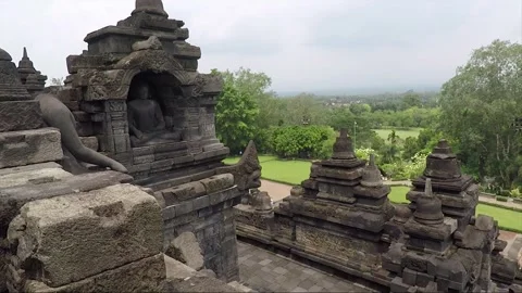 Buddha Statue, View from the Wall of Temple Terrace, Borobudur, Java, Indonesia 库存影片 244241967