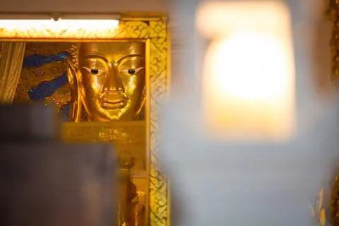 Buddha statue on yellow background 스톡 사진