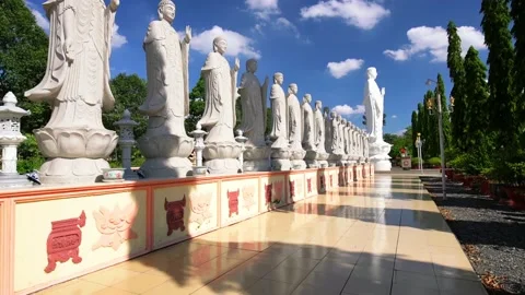 Buddha statues in alignment lead to Lord Buddha statue shining in  Pagoda Stock Footage 133495636