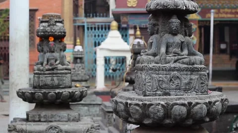 Buddha statues and the boy in red hoodie Stock Footage 59154279