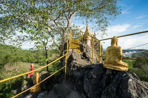 Buddha on a stone platform Stock Photos