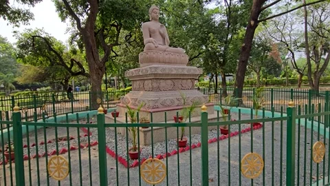Buddha’s Blessing: A Statue in the Heart of the Park Stock Footage 313563288