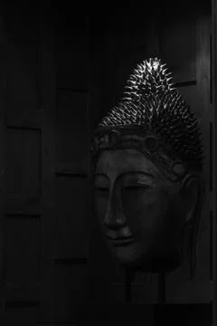 Buddha's head in dark tone and background Stock Photos