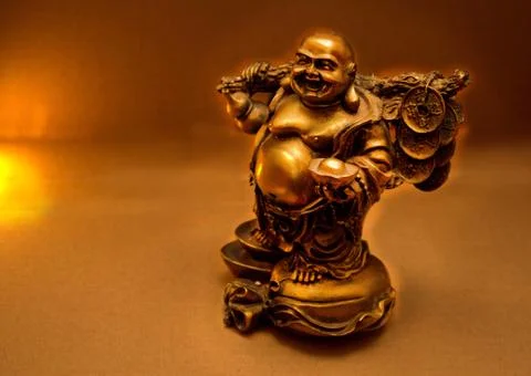 The Buddha`s statue glows with golden light Stock Photos