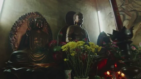 Buddhist altar with flowers Stock Footage 73519049