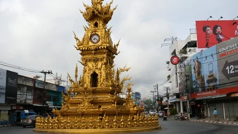 Buddhist architecture of clock tower in Chiang Rai and traffic, Thailand Stock-Footage 120586370