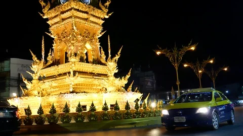 Buddhist architecture of clock tower in Chiang Rai and traffic, Thailand 스톡 동영상 120618703