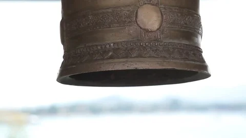 Buddhist bell close-up. The child's hand beats the bell in Thailand Stock Footage 77983763