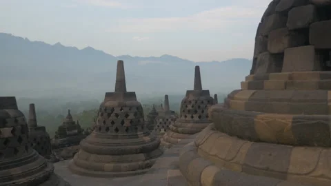 Buddhist Borobudur Temple under the mist at sunrise, in Indonesia Stock Footage 222754666