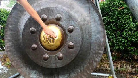 Buddhist circle is rubbed with a hand for good luck. Stock Footage 232220894