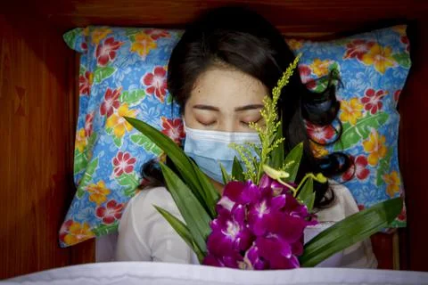 Buddhist devotees lie inside coffins for good karma, Bangkok, Thailand - 13 Feb  Stock Photos