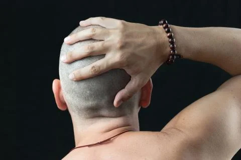 Buddhist feels shaved head Stock Photos