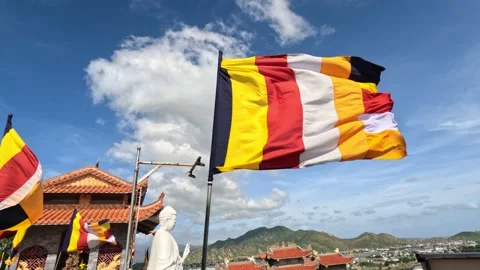 Buddhist flag in a temple is waving on a strong wind Stock Footage 242316405