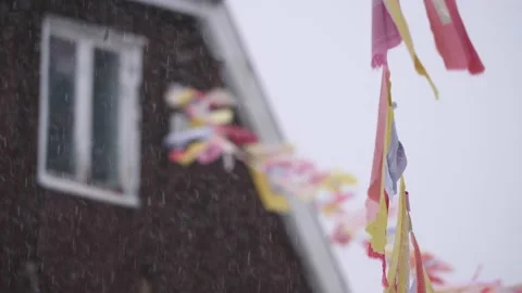 Buddhist Flags or Praying Flags Waving in Snowstorm, Buddhism and Winter scene Stock Footage 231699787