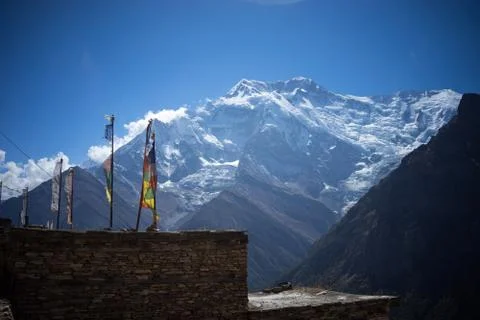 Buddhist gompa and prayer flags in the Himalaya range, Annapurna region, Nepal Stock Photos