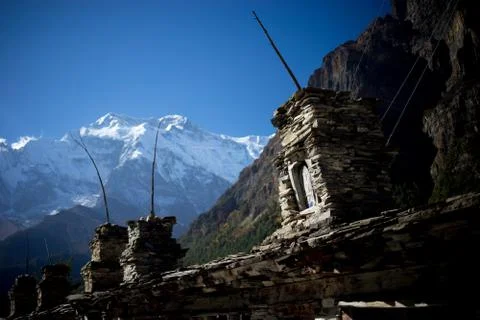 Buddhist gompa and prayer flags in the Himalaya range, Annapurna region, Nepal Stock Photos