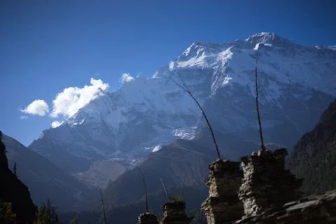 Buddhist gompa and prayer flags in the Himalaya range, Annapurna region, Nepal Stock Photos