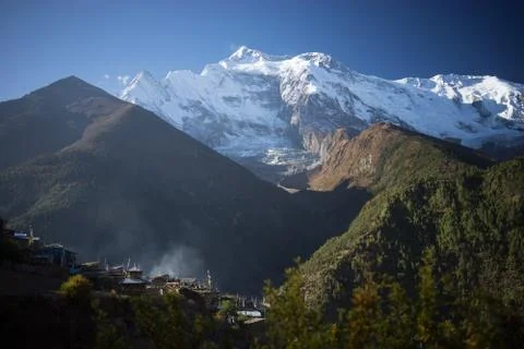 Buddhist gompa and prayer flags in the Himalaya range, Annapurna region, Nepal Stock Photos