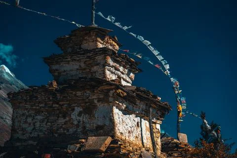 Buddhist gompa and prayer flags in the Himalaya mountains, Nepal Stock Photos