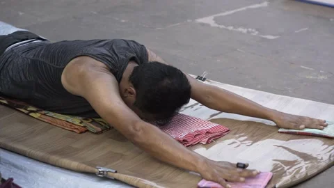 Buddhist man doing prostrations at complex Mahabodhi temple Stock Footage 230018183