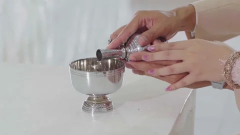 Buddhist merit making.Buddhist do the ceremonial pouring water dedicating  Video stock 305622930