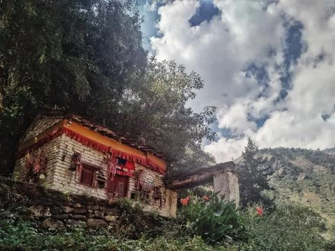 Buddhist monastery building with prayer flags flowers Stock Photos