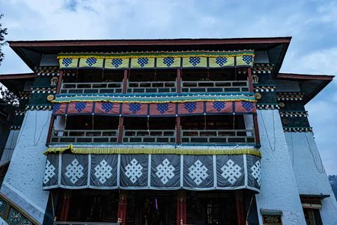 Buddhist monastery with decorated religious flags at day from low angle Stock Photos