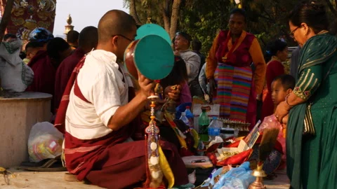 Buddhist monk chanting prayers and mantras in a traditional attire Stock Footage 285700899