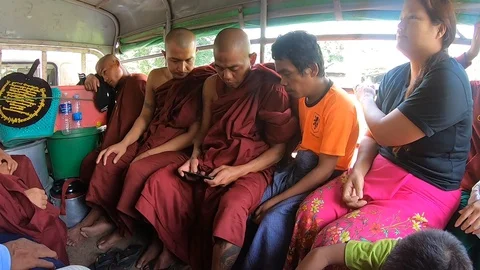 Buddhist Monk is playing with a phone Stock-Footage 119062081