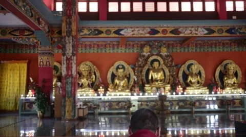 Buddhist Monk praying to buddha Stock Footage 60206794